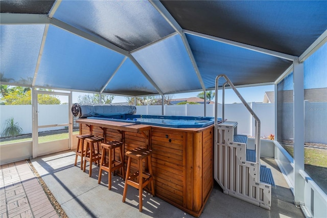 sunroom / solarium featuring lofted ceiling