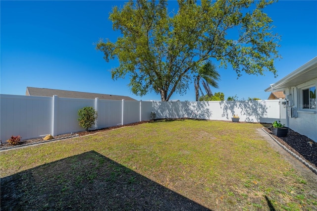 view of yard with a fenced backyard