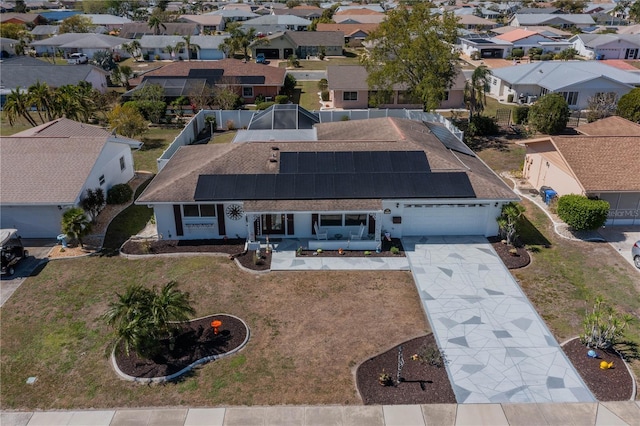 birds eye view of property with a residential view