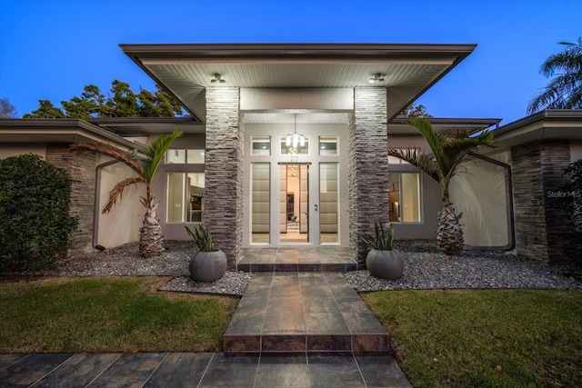 property entrance with french doors and stucco siding