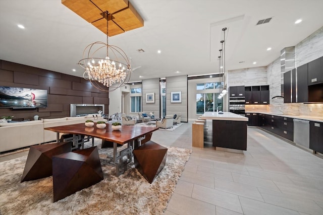 dining space featuring an inviting chandelier, light tile patterned flooring, recessed lighting, and visible vents