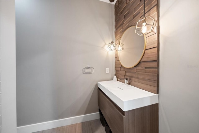 bathroom with vanity and baseboards