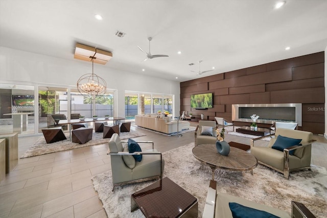 living room with recessed lighting, plenty of natural light, and an accent wall