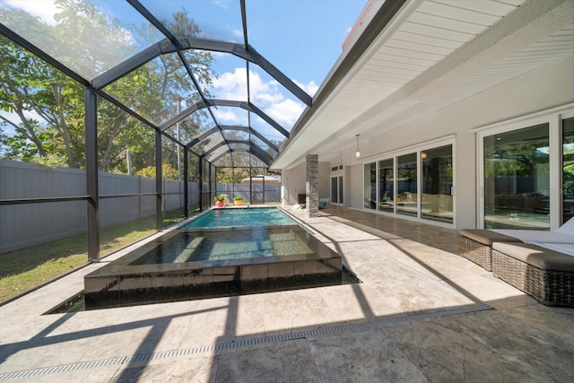 view of swimming pool with a patio area, a fenced in pool, a lanai, and a fenced backyard