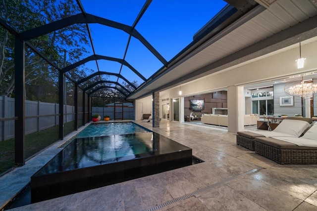 view of pool featuring glass enclosure, a patio, a fenced in pool, a fenced backyard, and an outdoor hangout area