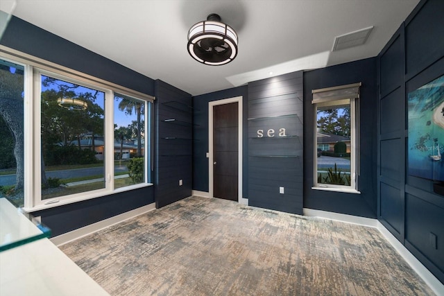 interior space with visible vents and baseboards