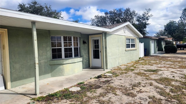 exterior space featuring stucco siding