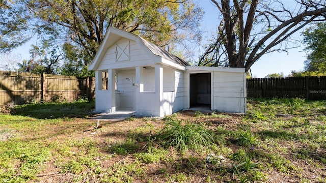 view of shed with a fenced backyard