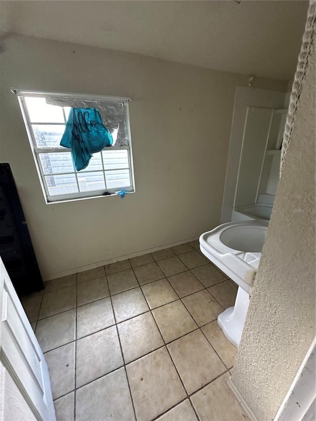 bathroom with tile patterned floors