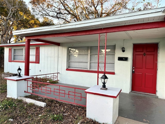 entrance to property with a porch