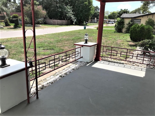 view of patio featuring fence