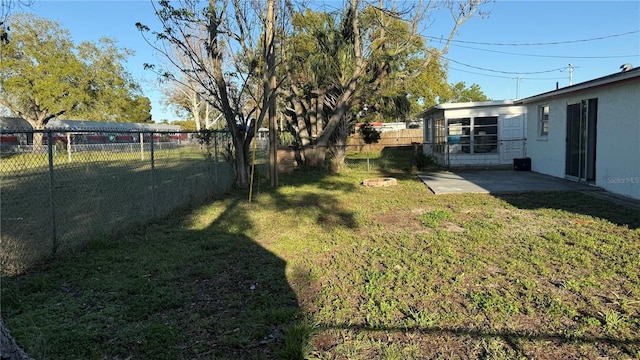 view of yard with a patio area and a fenced backyard