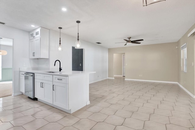 kitchen with a sink, a ceiling fan, white cabinetry, light countertops, and stainless steel dishwasher