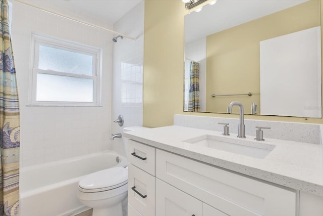 bathroom featuring shower / tub combo, vanity, and toilet