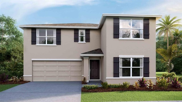 view of front of house with a garage, driveway, and stucco siding