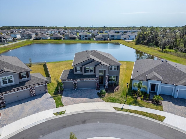 aerial view with a residential view and a water view