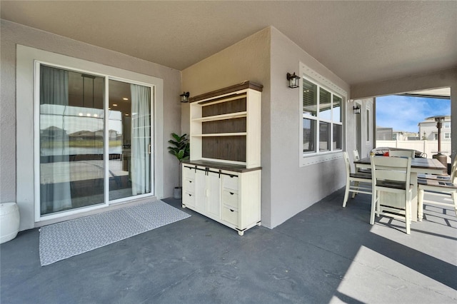 view of patio featuring fence