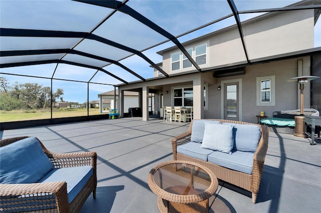 view of patio featuring a lanai, outdoor lounge area, and outdoor dining area