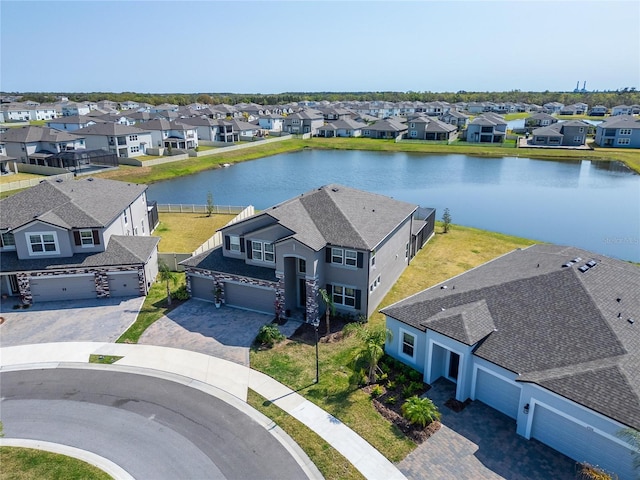 birds eye view of property with a residential view and a water view