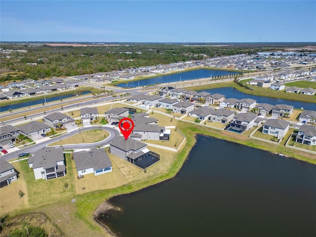 aerial view with a residential view and a water view