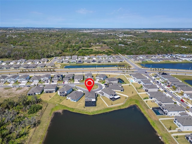 birds eye view of property featuring a residential view and a water view