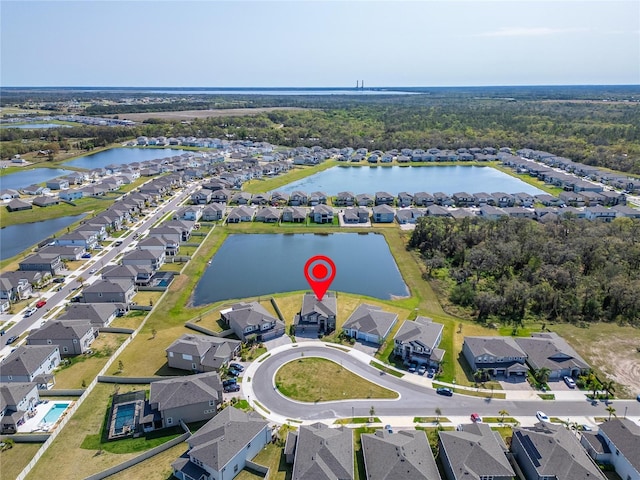 birds eye view of property featuring a residential view and a water view