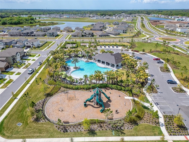 bird's eye view featuring a residential view and a water view