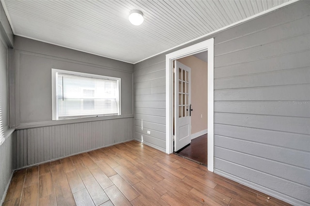 spare room featuring wood finished floors