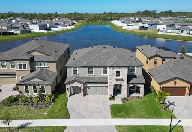 bird's eye view with a residential view and a water view