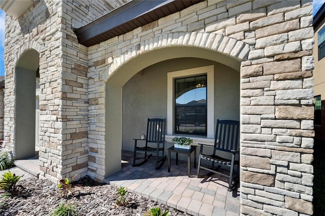 entrance to property with stone siding