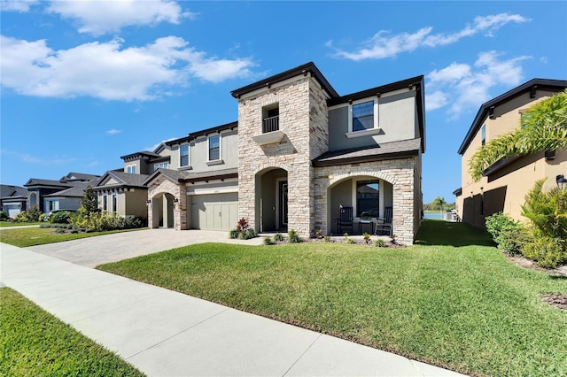 view of front of house featuring a porch, a garage, decorative driveway, stucco siding, and a front lawn