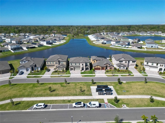 birds eye view of property featuring a residential view and a water view