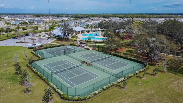 birds eye view of property with a residential view