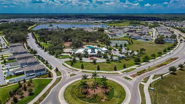 bird's eye view with a residential view and a water view