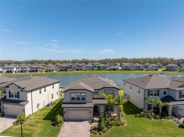 bird's eye view featuring a residential view and a water view