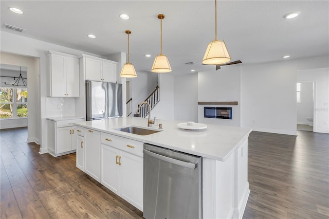 kitchen with dark wood-style floors, visible vents, appliances with stainless steel finishes, and recessed lighting