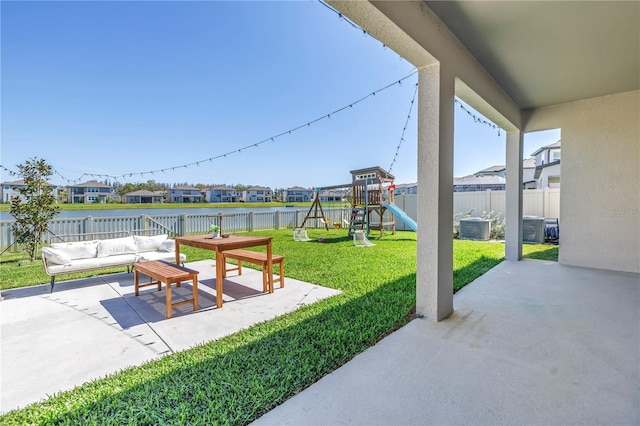 view of patio / terrace with a fenced backyard, a residential view, an outdoor hangout area, playground community, and central AC