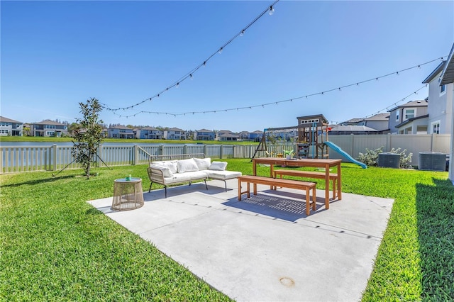 view of patio / terrace featuring a fenced backyard, a residential view, an outdoor hangout area, a playground, and central AC