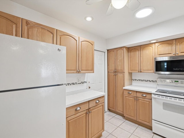 kitchen with backsplash, light countertops, light tile patterned flooring, white appliances, and a ceiling fan