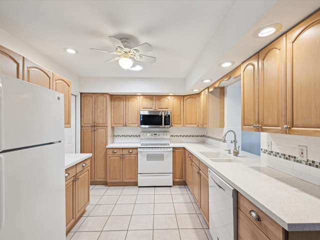 kitchen featuring white appliances, light tile patterned flooring, a sink, light countertops, and tasteful backsplash