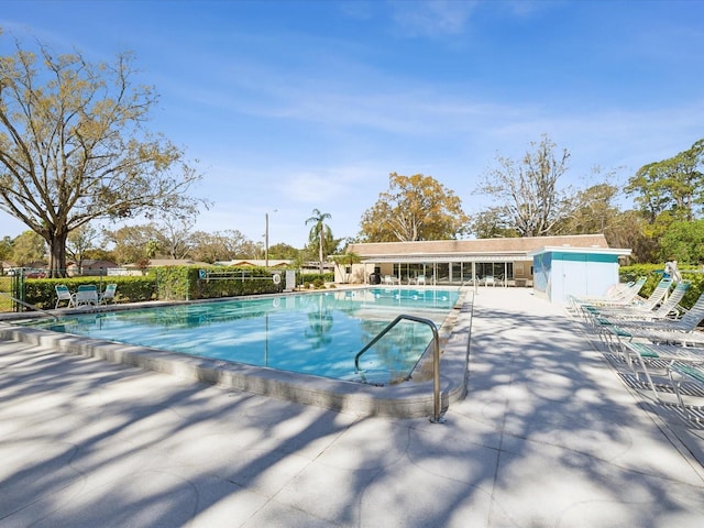 community pool with a patio area