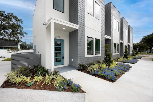 doorway to property with stucco siding