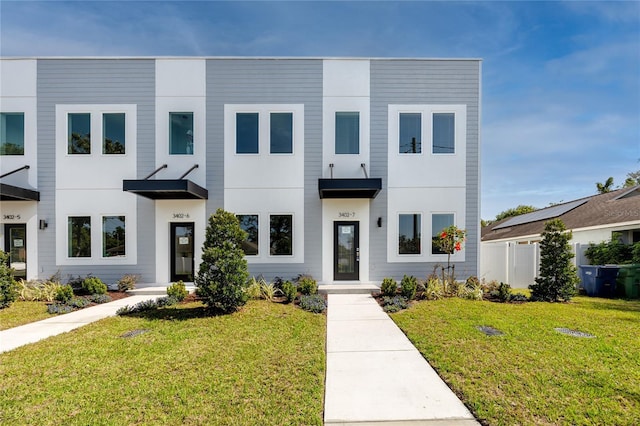 3402 E 28th Ave Unit 7, Tampa, FL 33605 - view of front of home featuring a front yard