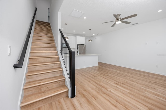 3402 E 28th Ave Unit 7, Tampa, FL 33605 - staircase featuring a ceiling fan, recessed lighting, wood finished floors, and baseboards