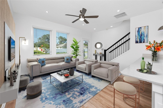 3402 E 28th Ave Unit 7, Tampa, FL 33605 - living area with wood finished floors, a ceiling fan, stairs, and recessed lighting