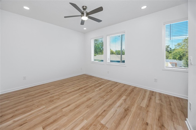 3402 E 28th Ave Unit 7, Tampa, FL 33605 - spare room featuring light wood-style flooring, a ceiling fan, baseboards, and recessed lighting