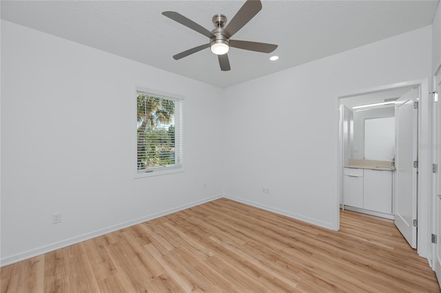 3402 E 28th Ave Unit 7, Tampa, FL 33605 - spare room with light wood-style flooring, a ceiling fan, baseboards, and recessed lighting