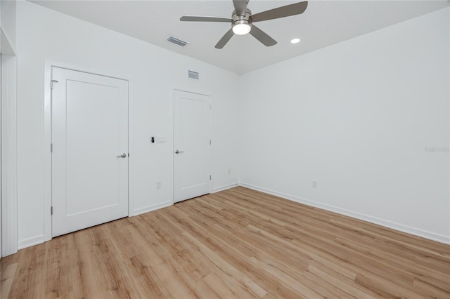 3402 E 28th Ave Unit 7, Tampa, FL 33605 - unfurnished bedroom featuring light wood-style flooring, baseboards, and ceiling fan