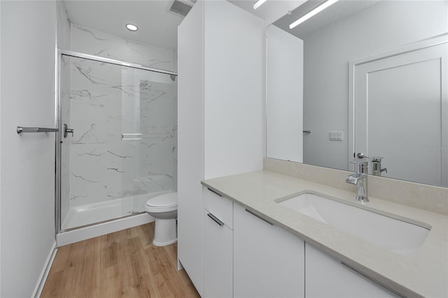 3402 E 28th Ave Unit 7, Tampa, FL 33605 - full bathroom with toilet, vanity, a marble finish shower, and wood finished floors