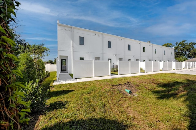 3402 E 28th Ave Unit 7, Tampa, FL 33605 - rear view of house featuring stucco siding